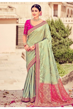 Lite pista green plain body georgette designer saree,contrast border &  blouse with floral deisgn embroidery & sequinwork