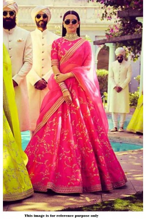 Photo of bride in a pastel pink sabyasachi lehenga with floral motifs