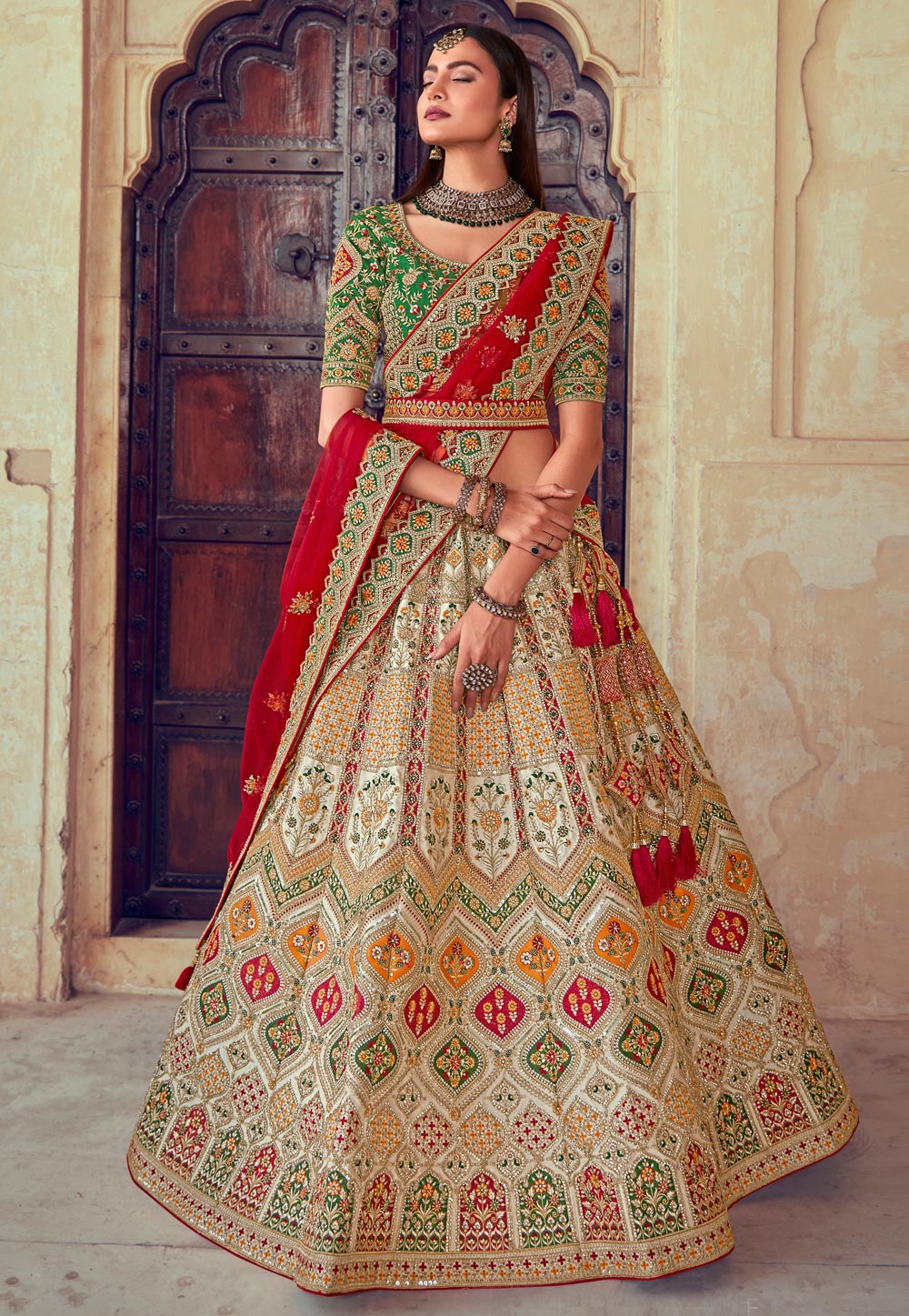 Photo of Dark green lehenga for mehendi with small motifs and red blouse  and dupatta