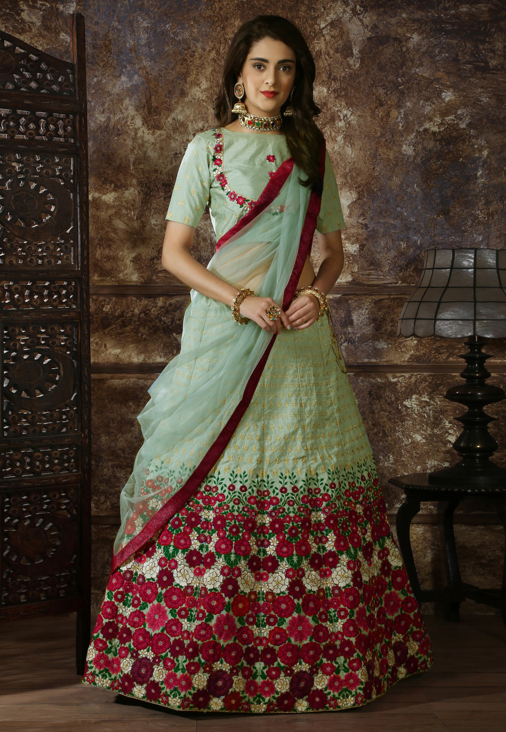 Pista Green soft net Lengha Choli with matching dupatta.