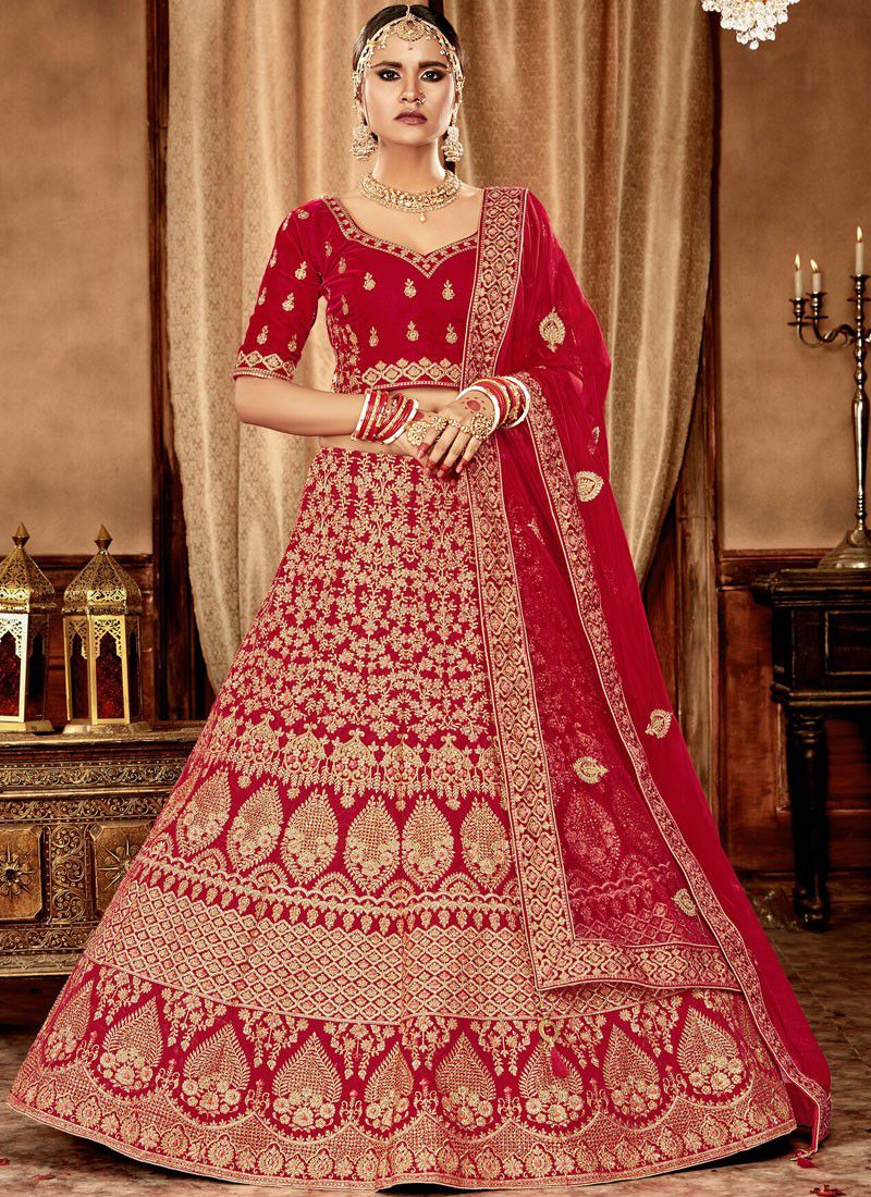 Buy Red Zari Embroidery Velvet Bridal Wear Lehenga from Ethnic Plus.