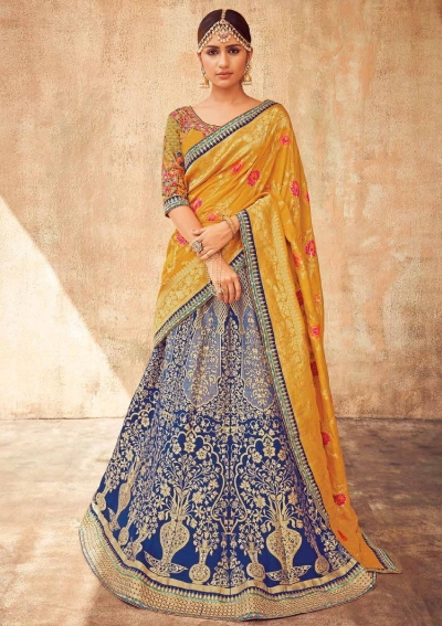 Yellow lehenga with royal blue voni designed by sony reddy | Fashion, Yellow  lehenga, Indian design
